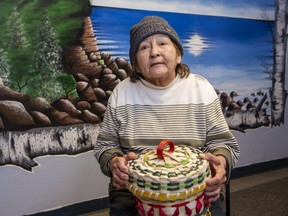 Marlene Cloud, 80, a residential school survivor who lives on Kettle and Stony Point First Nation near Forest, is travelling to Rome as part of an Indigenous delegation that will meet with Pope Francis. Cloud is holding a basket she will present to the Pope. "The art of basket-making was almost lost because of residential schools, so this is a symbol of our resilience," said Cloud's daughter Joanna Cloud. (Derek Ruttan/The London Free Press)