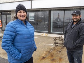Kerri Egan and Roberto Briceno stand outside 308 Wellington St. in St. Thomas where Boxcar Donuts plans to open its third store this summer.  (Mike Hensen/The London Free Press)
