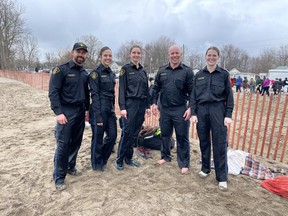 Norfolk OPP Constables Jeremy Renton, Tonia Veenstra, Elisha Duyvestijn, David Carvalho and Mara Wilson wore their uniforms into Lake Erie at Turkey Point for a polar plunge, raising funds for Special Olympics Ontario on Saturday.