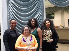 Lana Santana (Front) poses with keynote speaker Dr. Miriam Sekandi, VP of NBCC Joy Thomas and another award recipient after receiving the Mary Burlie award. Photo supplied.