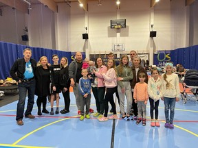 Oleg and Irene Stepus, far left, from Brantford, are shown with several Ukrainian refugee families who fled the war in their country and are living in a gymnasium in Poland while awaiting clearance to come to Canada.
