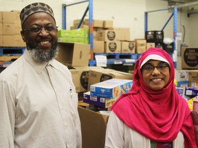 Imam Michael Taylor, left, and Mona Rahman, co-chairs of the Give 30 Team Kingston campaign, at the Partners in Mission Food Bank in Kingston on May 29, 2018. Proceeds of the campaign go straight to the food bank.