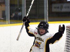 Danica Voros of the Mitchell U11 girls hockey team celebrates one of her goals as the Meteors went on to capture the division championship of their own tournament March 4-6. The U15's did, too! ANDY BADER/MITCHELL ADVOCATE