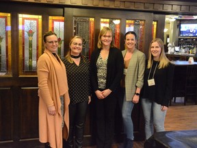 Community Links engagement service manager Laurie Jacob-Toews (centre) stands with 100 Airdrie Women Jane Leblanc (from left to right), Melissa Thome, Amy Forrest and Hilary Noble after the group voted at their March 1 meeting.