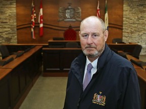 Hastings County Warden Rick Phillips, above in the council chamber in 2021, says the county has lifted its emergency declaration. Other measures are still in effect.