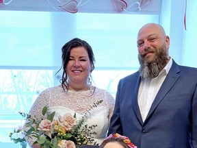 Bride Kristin Maracle and her new husband, Larry, pose with Kristin's late mother, Valerie Maracle, in the intensive-care unit at Belleville General Hospital. Kristin asked to be married in the unit so her mother could be part of the very small ceremony.