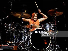 Taylor Hawkins of Foo Fighters performs on stage at Rod Laver Arena in Melbourne, Australia. Hawkins' shocking death earlier last week rattled the rock world. MARTIN PHILBEY/REDFERNS via GETTY IMAGES