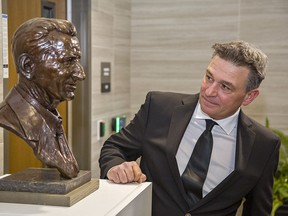 Glen Gretzky looks at a bronze bust of his father Walter Gretzky, that was unveiled on Friday.  Brian Thompson/Brantford Expositor/Postmedia Network