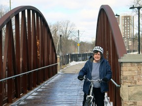 Anne Crowe, chair of The Grand Watershed Trails Network, takes a break from cycling on the Trans Canada Trail/Grand Trail in Waterloo Park. The network has launched a new website for cyclists, paddlers and hikers who use the Grand River trail system. Submitted