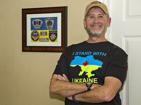 Steve Long of Brantford wears one of the t-shirts he is selling to support people who helped him while in Ukraine. An officer with Aylmer Police Service, Long took part in a year-long Canadian Police Mission in Ukraine to help train the country's police services.
