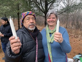 Tata Victor and Lorraine Moir show their white candles, which were used in a Mayan fire ceremony held as part of the Land of the Dancing Deer Spring Equinox on Six Nations of the Grand River on Saturday. The event attracted more than 20 people.