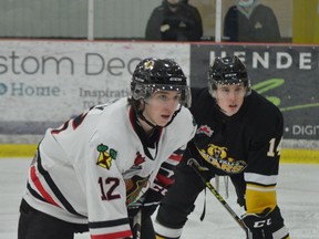 Owen Rainey (left) of the Braves and Lleyton McLean of Smiths Falls are in the Bears' end for a faceoff during the first period at the Brockville Memorial Centre on Friday, March 4. The Braves went on to edge the Bears 3-2.
Tim Ruhnke/The Recorder and Times
