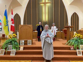 Edgar Tumak, Debbie Donaldson and Olga Lazor stand together at Grace United Church in Gananoque for the peace vigil for Ukraine on Sunday.(SUBMITTED PHOTO by ROBYN ABLESON)