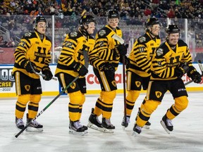 Gavin White (next to right) and his Bulldog teammates hit the ice in the OHL Outdoor Showcase at Tim Hortons Field in Hamilton on Monday. A crowd of more than 12,500 was on hand to watch the 19-year-old defenceman from Brockville pick up two assists and be named second star in the Bulldogs' 3-0 win against the Oshawa Generals.
Brandon Taylor/OHL