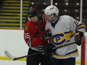 Brockville defenceman Reece Glover-Kirby holds Carleton Place forward Matteo Disipio by the Braves net during a game at the Memorial Centre two Fridays ago. Disipio had a goal and assist and was named first star in the Canadians' 6-4 win over Brockville in Carleton Place on Sunday afternoon.
File photo/The Recorder and Times