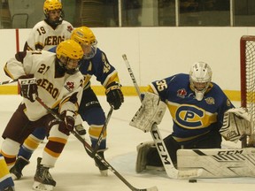 William Huffman of Athens goes for the puck as Carleton Place defenceman Austin Howard and goalie Jackson Pundyk try to stop the scoring chance while Samuel Gray (back) looks on during the Aeros' regular season home-opener in early October. The Aeros and Jr. Canadians will meet in the next round of the EOJHL playoffs.
File photo/The Recorder and Times