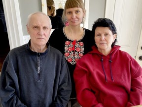 Natasha Edwards poses with her newly-arrived parents, Pavel Khodyriev and Liudmyla Khodyrieva, at her home in Lyn on Monday. (SUBMITTED PHOTO)