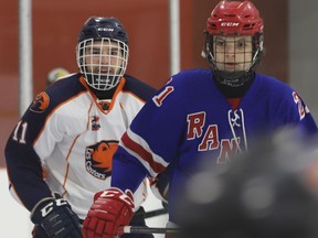 Clarence defenceman Caleb Smith (left) and South Grenville forward Connor Van Luit watch the play from in front of the Castors net during game one of the Jr. C championships Saturday.
Tim Ruhnke/The Recorder and Times