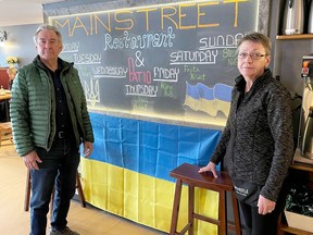 Owner Mike Neelin, left, and manager Terri Graham of Mainstreet Family Restaurant have helped to raise nearly $5,000 so far in funds for the people of Ukraine during the three-week Merrickville Stands with Ukraine initiative. (MARSHALL HEALEY/The Recorder and Times)