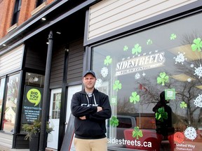 Tyler Ouellette, a volunteer director at SideStreets Youth Centre in Dresden, stands in front the renovated fascade of the centre's building that was made possible thanks to donations from the Chatham-Kent Community Foundation and South Kent Wind, along with a community improvement grant through The Municipality of Chatham-Kent. Ellwood Shreve/Postmedia