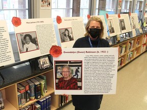 The Chatham-Kent Public Library and Chatham-Kent Sexual Assault Crisis Centre, in partnership, have created a display to celebrate women who have inspired others and have made significant contributions to our world throughout history. Heidi Wyma, manager of support services at the Chatham Library, holds a display detailing the accomplishments of Chatham's own Gwen Robinson. Ellwood Shreve/Postmedia