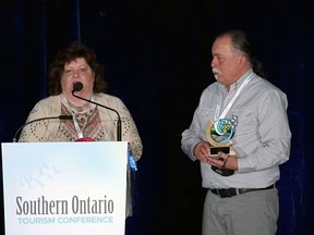 TJ Stables co-owners Terry Jenkins and John Basden accept the award for Innovative Experience of the Year at the Southern Ontario Tourism Conference March 9.