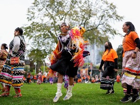 Natasha Saddleback, from Samson Cree Nation in Treaty 6 territory, takes part in a Ladies Fancy Shawl dance during Canada's first National Day for Truth and Reconciliation, honouring the lost children and survivors of Indigenous residential schools, their families and communities, in Toronto, Ontario, Canada September 30, 2021.