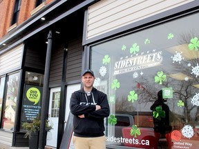 Tyler Ouellette, a volunteer director at SideStreets Youth Centre in Dresden, stands in front the renovated fascade of the centre's building that was made possible thanks to donations from the Chatham-Kent Community Foundation and South Kent Wind, along with a community improvement grant through The Municipality of Chatham-Kent. PHOTO Ellwood Shreve/Chatham Daily News