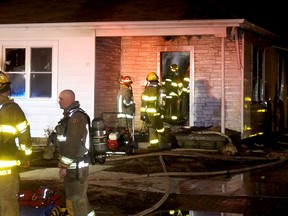 Chatham firefighters from Stations No. 1 and 2 were called to battle a house fire at 133 St. George Street in Chatham on Wednesay night. PHOTO Ellwood Shreve/Chatham Daily News