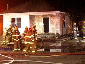 Chatham firefighters from Stations No. 1 and 2 were called to battle a house fire at 133 St. George Street in Chatham on Wednesay night.  PHOTO Ellwood Shreve/Chatham Daily News
