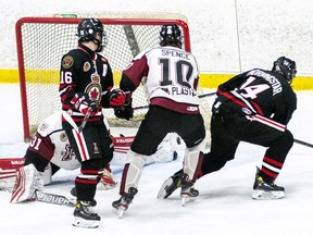 Chatham Maroons' Craig Spence (10) and goalie Nolan DeKoning battle Sarnia Legionnaires' Wil O'Leary-Dilosa (16) and Jett Morningstar (14) at Pat Stapleton Arena in Sarnia, Ont., on Thursday, March 10, 2022. (Shawna Lavoie Photography)