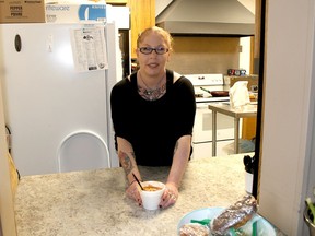 Renne Hamm, a volunteer at Chatham Hope Haven, will be continue to serve up a hot soup and other food as the day program at the downtown shelter continues to operate even with a new emergency shelter slated to open in May in a nearby former elementary school building on Murray Street. (Ellwood Shreve/Chatham Daily News)