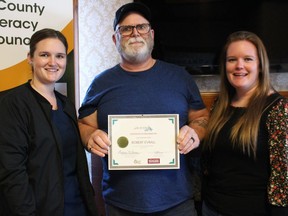 Robert Evrall is the winner of the Take the Wheel favourite truck driver contest that the literacy council held, and he's with his daughters Robyn Prendergast (left) and Jessyca Evrall. Photo on Tuesday, March 8, 2022, in Cornwall Ontario.Todd Hambleton/Standard-Freeholder/Postmedia Network