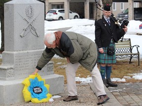 Noel Windle, of the Long Sault Branch 569 of the Royal Canadian Legion, places a wreath at the base of the cenotaph in Ingleside. Photo on Tuesday, March 15, 2022, in Ingleside, Ontario.Todd Hambleton/Standard-Freeholder/Postmedia Network