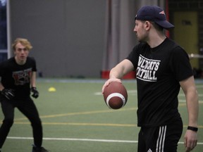 Linebackers coach Cameron Howes providing directions during a drill at the Benson Centre. Photo on Sunday, March 20, 2022, in Cornwall, Ontario.Todd Hambleton/Standard-Freeholder/Postmedia Network