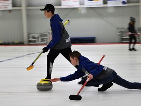 From left, Maverick Dupuis and Cameron Wright representing Cornwall during the U15 Curling Challenge Cup at the Cornwall Curling Centre on Saturday March 26, 2022 in Cornwall, Ont. Shawna O'Neill/Cornwall Standard-Freeholder/Postmedia Network