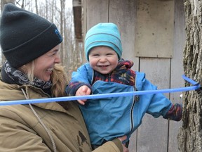Shannon and Eddie Duncan enjoying the SNC Tap Into Maple event at the Oschmann Forest Conservation Area on Saturday March 26, 2022 in North Dundas, Ont. Shawna O'Neill/Cornwall Standard-Freeholder/Postmedia Network