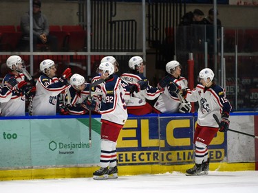 Cornwall Colts Brayden Bowen (No. 92) and Simon Laferriere (No. 15) get their fist-bumps from teammates after scoring the team's first goal against the Carleton Place Canadians on Thursday March 24, 2022 in Cornwall, Ont. The Colts won 4-2. Robert Lefebvre/Special to the Cornwall Standard-Freeholder/Postmedia Network