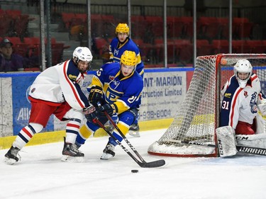 Carleton Place Canadians Gino Colangelo fights for the puck as he rounds Cornwall Colts goaltender Emile Savoie's crease on Thursday March 24, 2022 in Cornwall, Ont. The Colts won 4-2. Robert Lefebvre/Special to the Cornwall Standard-Freeholder/Postmedia Network