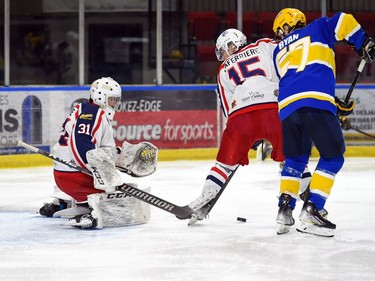 Cornwall Colts Simon Laferriere takes the puck out from in front of goaltender Emile Savoie during play against the Carleton Place Canadians on Thursday March 24, 2022 in Cornwall, Ont. The Colts won 4-2. Robert Lefebvre/Special to the Cornwall Standard-Freeholder/Postmedia Network