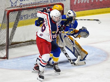 Cornwall Colts Ben Lapier stands his ground in front of Carleton Place Canadians goaltender Brady McEwan during play on Thursday March 24, 2022 in Cornwall, Ont. The Colts won 4-2. Robert Lefebvre/Special to the Cornwall Standard-Freeholder/Postmedia Network