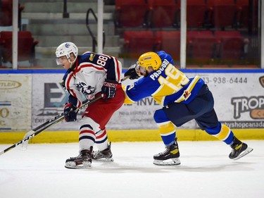 Cornwall Colts Keanu Krenn fends off a hook from Carleton Place Canadians Isaac Pascoal on Thursday March 24, 2022 in Cornwall, Ont. The Colts won 4-2. Robert Lefebvre/Special to the Cornwall Standard-Freeholder/Postmedia Network