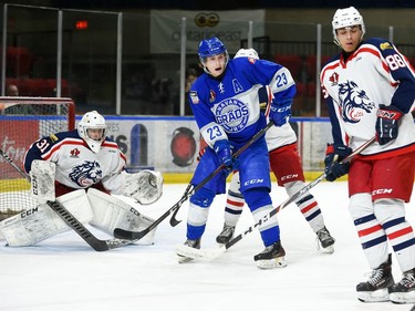 Cornwall Colts goaltender Emile Savoie and Keanu Krenn, right, with Navan Grads Gabriel Crete in the middle, during play on Thursday March 10, 2022 in Cornwall, Ont. The Colts won 1-0 in OT. Robert Lefebvre/Special to the Cornwall Standard-Freeholder/Postmedia Network