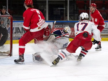 Pembroke Lumber Kings Gavin Ewles, along with everyone else near Cornwall Colts goaltender Dax Easter's crease looks for the rebound on Thursday March 17, 2022 in Cornwall, Ont. The Colts lost 2-1. Robert Lefebvre/Special to the Cornwall Standard-Freeholder/Postmedia Network