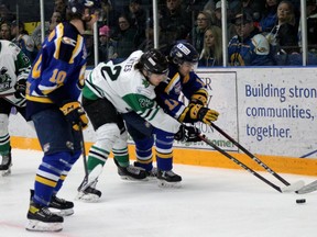 Fort McMurray Oil Barons forward Max McCoy and Drayton Valley Thunder defenseman Adam Oates at Centerfire Place on Saturday, March 19, 2022. Laura Beamish/Fort McMurray Today/Postmedia Network