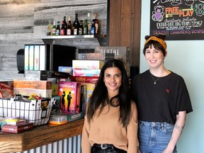 Avenue Eatery and Café owner Sarah Thapa (left) and head chef Cassidy Paxton stand by some of the games available to play at the cafe. Laura Beamish/Fort McMurray Today/Postmedia