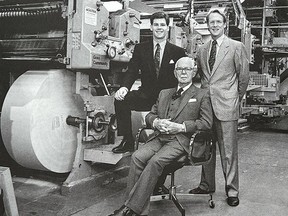 Former Whig-Standard publisher and owner Michael Davies, right, with his son Eric, left, and father Arthur, seated, in the new Whig-Standard offset printing plant in October 1990. Jack Chiang/The Kingston Whig -Standard/Postmedia Network