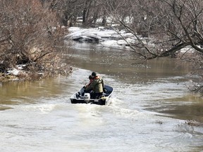 Members of the OPP's Search and Recovery Team patrol Whirl Creek east of Road 160 in Mitchell March 9 for a missing 10-year-old girl who fell through the ice four days earlier.  ANDY BADER/MITCHELL ADVOCATE/POSTMEDIA NETWORK