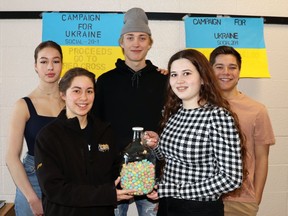 Social 20 students (l-r) Sarah Blasko, Jasmine Wegewitz, Logan Chadd, McKenna Hillgardner and Maxwell Gilroy are participating in the MHS Campaign for Ukraine. The Mayerthorpe High School students are holding various fundraisers for the Canadian Red Cross, including an ongoing competition to count the number of Easter Mini Eggs in a jar.