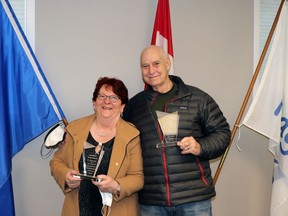 Retired doctors Mary Aird and Jeff Lowe received plaques from the Town of Mayerthorpe in recognition of their long and caring service during a reception Monday.